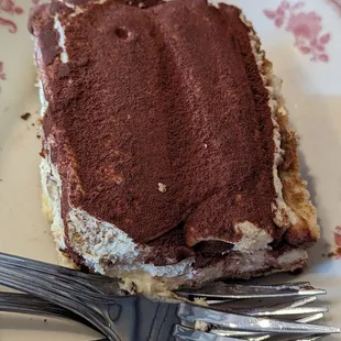 a piece of cake on a plate with a fork