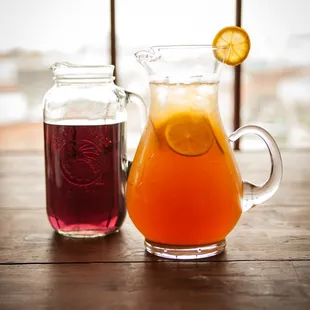 a pitcher and a glass of tea