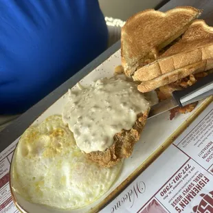 Country fried steak &amp; eggs with toast