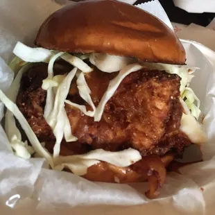 a chicken sandwich with coleslaw