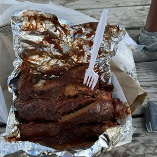 3 combo 2 sides.  Pork ribs,  Hot links, Sliced beef.  In Hot bbq sauce.