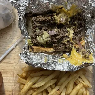Steak and Cheese Sub; used red onions (a change from the grilled white). Fries are regular, but bland (a change from prior crinkled-fries).