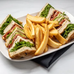 Keno's Chicken Club Sandwich: grilled chicken breast, swiss cheese, bacon, lettuce, tomato &amp; mayo. Order it with crispy french fries.