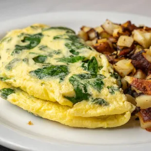 Our Spinach omelet can be served with o'Brien potatoes, hash browns, sliced tomatoes, cottage cheese, or fruit. Ask your server for options.