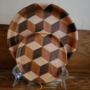 a wooden plate with a geometric pattern