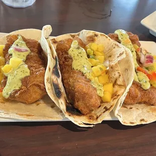 three fish tacos with mango salsa