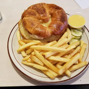 Turkey and Swiss on a croissant with fries