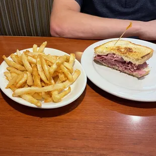 Cornbeef &amp; Swiss Sandwich with Fries (only half the sandwich is shown)