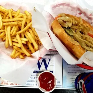 jumbo vegan hot dog, french fries, and a canned soda