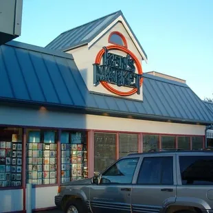 a car parked in front of the store