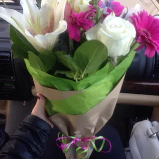 a person holding a bouquet of flowers