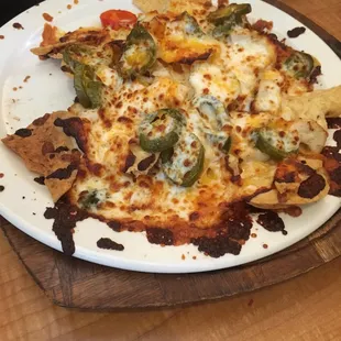 Burnt food. Slow service. 20 minutes for nachos.