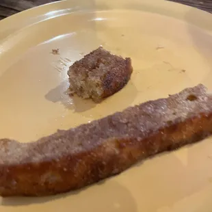 a half eaten donut on a plate