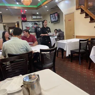 a group of people sitting at tables