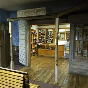 a wooden bench in front of a store