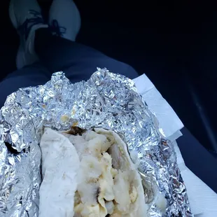 a burrito wrapped in aluminum foil