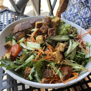 a bowl of salad on a table