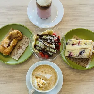 Top to clockwise: Iced cherry blossom latte, lemon berry mascarpone cake, dulce de leche latte (hot), guava quesito, relaxing bowl (middle).