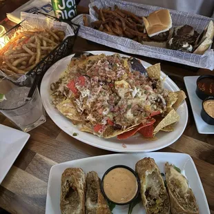 Chili Nachos + Philly Cheesesteak Rolls + Truffle Fries + Trio of Kobe Beef Sliders