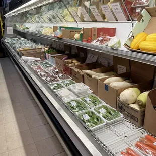a display of vegetables and fruits