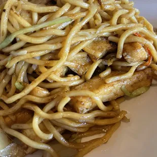Noodles with tofu and shrimp underneath delicious flavor.