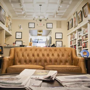 a leather couch in a library