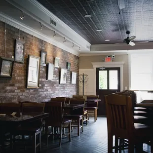 a restaurant with brick walls