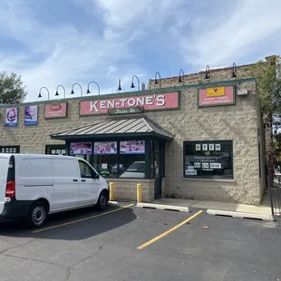 a van parked in front of the store