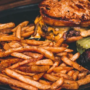 a burger and fries on a plate