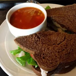 Roasted turkey sandwich on rye, with cup of vegetable soup