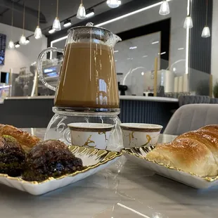 Mofawar coffee (large pot), baklava (plain and chocolate), and a cinnamon chocolate pastry