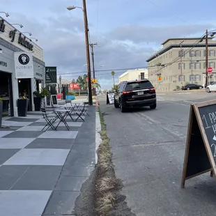 a sign on the sidewalk