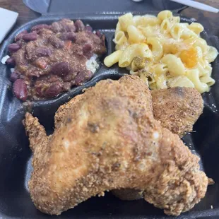 Fried Chicken Entree with read beans and rice and Mac and cheese.