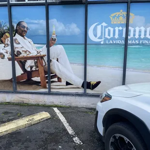 a man sitting in a chair on the beach