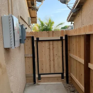 The gate is reinforced with a metal frame.