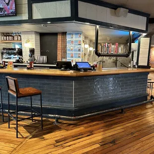 a bar with a television on the wall