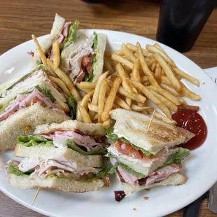 Club sandwich with fries