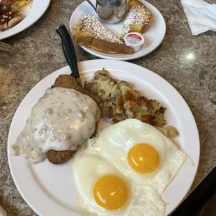 Country fried steak with home fries and French toast on the side!