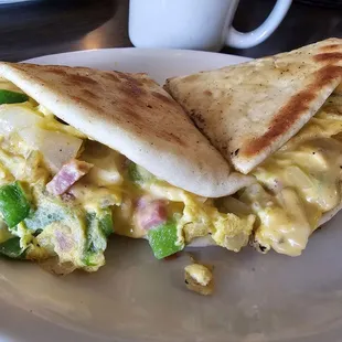 Breakfast Tandoori Sandwich, with ham, eggs, sautéed peppers, and onions on tandoori bread. Delicious!