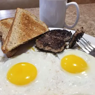 The daily breakfast special: 2 eggs, hand-pattied sausage, and 2 slices of wheat toast, with a coffee. Reasonably priced, and delicious!
