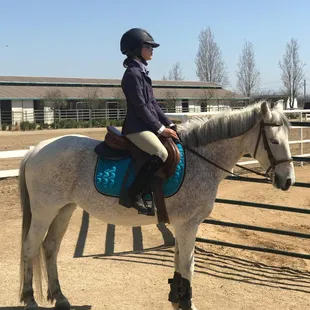 Rania ridding Cheyenne at a barn show.