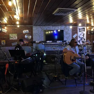 musicians playing instruments and singing