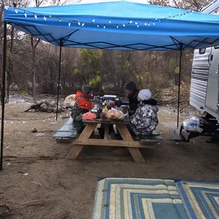 The new 10x10 easy-up outside or 27' trailer with a slide out (The Komfort).