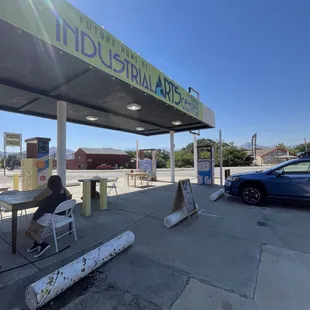 Converted gas station into a cute coffee and used book stand for charity
