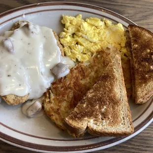 Country fried steak, scrambled eggs, hash browns, and toast