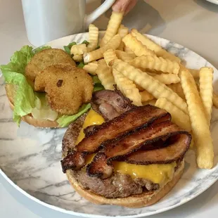 &quot;Southern Delight&quot; burger with fried green tomatoes, jalapeño Bacon, cheddar cheese &amp; bib lettuce. Very good!