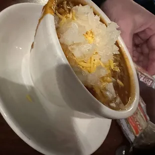 a person holding a bowl of food