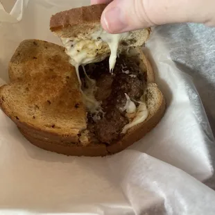a sandwich with cheese and meat