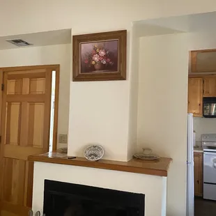 Chimney and view of small kitchen
