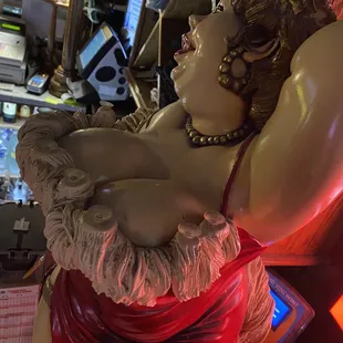 a statue of a woman in a red dress